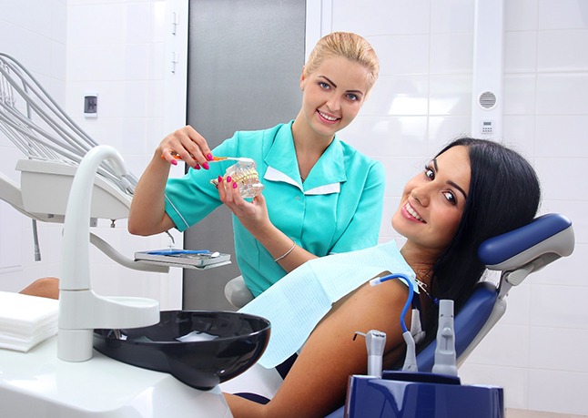 dentist talking to patient about a dental bridge in Rome