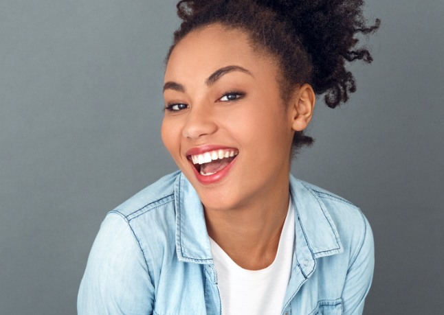 Woman sharing bright smile after at home teeth whitening