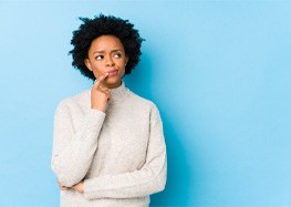 puzzled woman for cost of cosmetic dentistry in Rome 