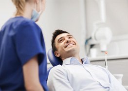 man at consultation for cost of cosmetic dentistry in Rome 
        