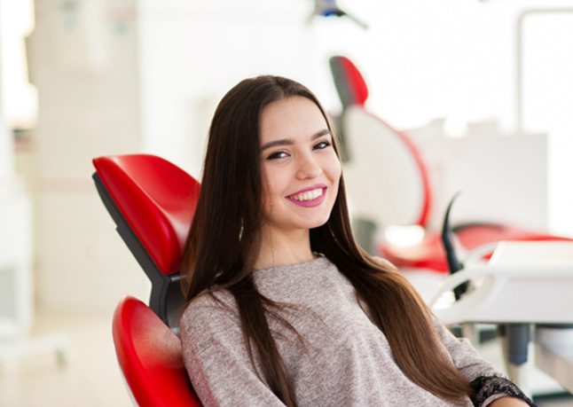 A woman seeing a cosmetic dentist in Rome 