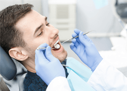 Man attending dental checkup with the goal of preventing dental emergencies