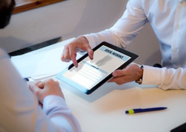 An Insurance agent discussing dental insurance with a patient