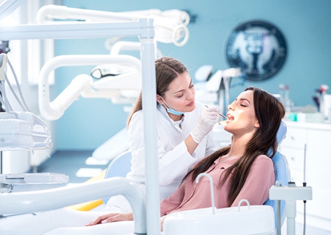 Woman undergoing dental cleaning in Rome