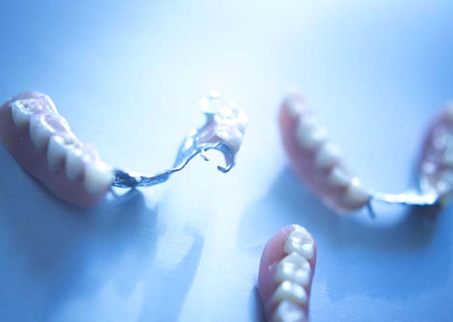 Partial dentures in Rome on blue background 