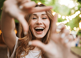 a woman with dentures flashing her healthy smile