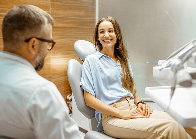Lady smiles at dentist