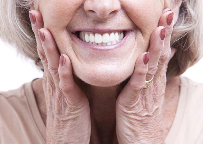 Closeup of beautiful smile after full mouth reconstruction in Rome