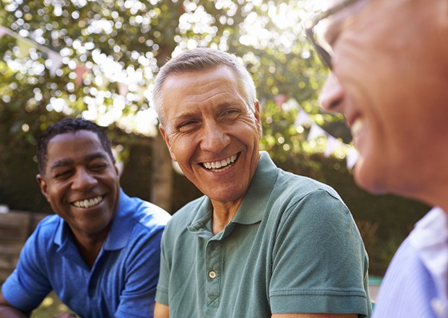 group of men laughing outside 