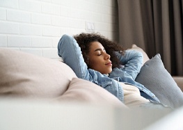 Woman resting after receiving dental implants in Rome