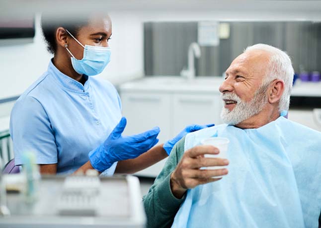 patient speaking to implant dentist in Rome