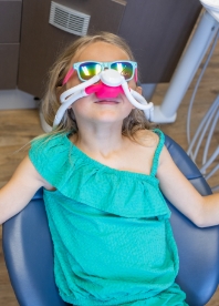 Dental team member giving patients dental insurance information