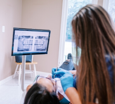 WOman laughing in dental chair