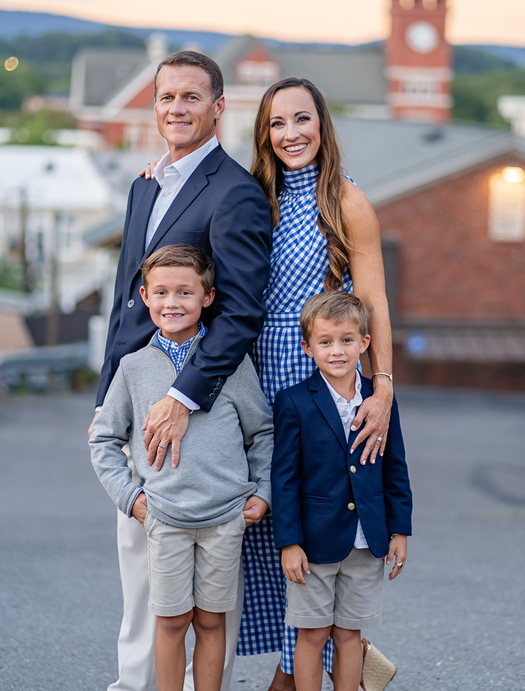 Doctor Weldon and his family in front of the dental office