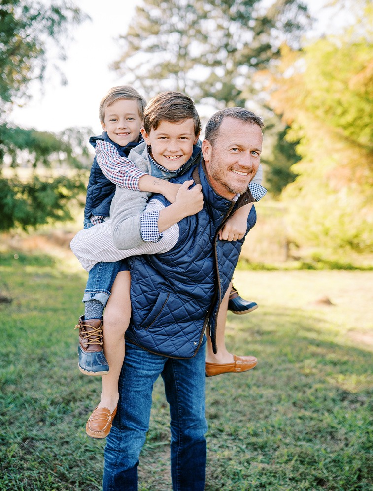 Doctor Weldon and his family in front of the dental office