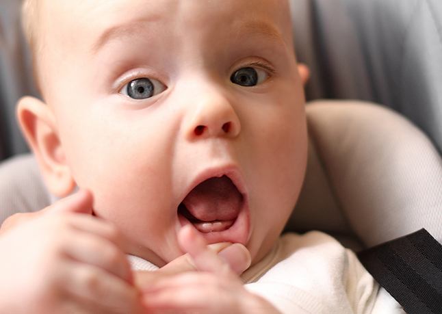 Baby with two teeth erupting