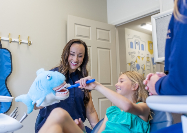 Girl high-fiving the dentist