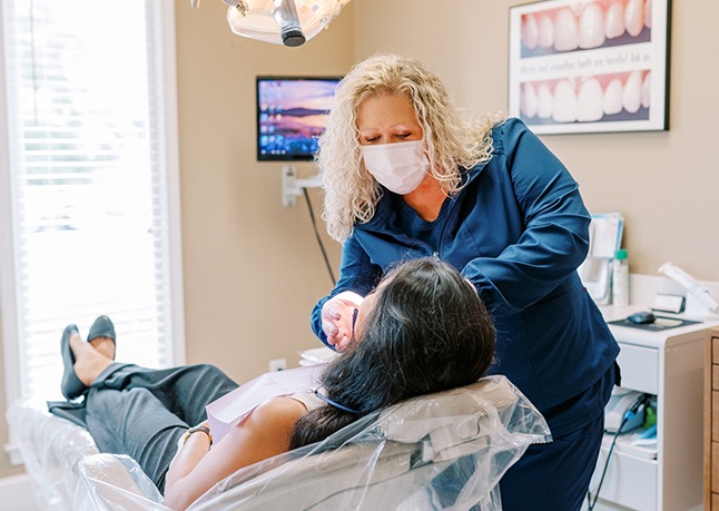 Man receiving an oral cancer screening