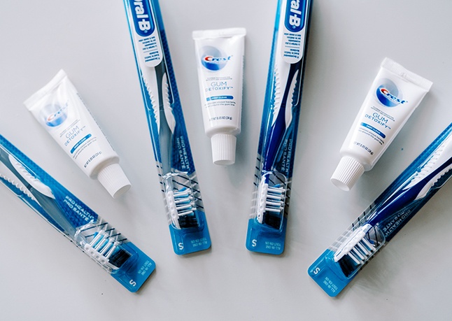 Family using at home dental hygiene products to maintain oral health