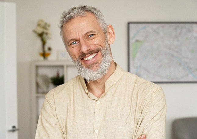 a man brushing to preserve his teeth whitening in Rome