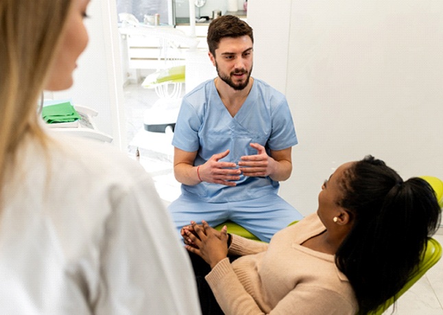 dentist explaining a smile makeover in Rome