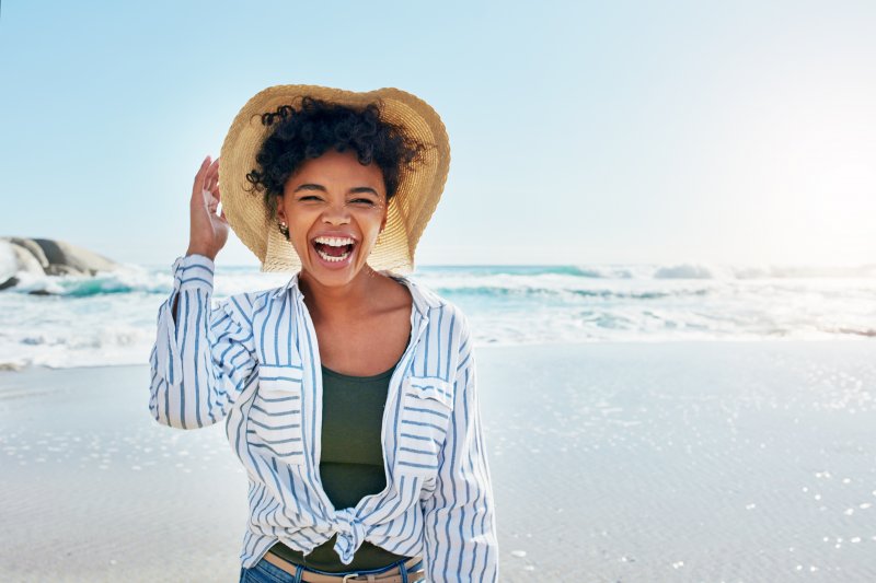 woman smiling by the beach 