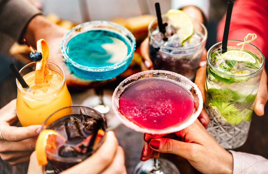 Close up of drinks in people's hands