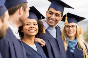 Graduating students smiling 