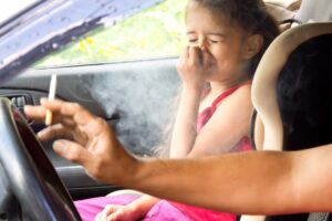 Child experiencing secondhand smoke